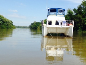 The Joint Adventure anchored in Little Diversion Creek. The Mississippi is in the background, through the opening in the trees