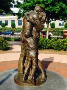 This is a statue along the waterfront of a soldier returning home to his family -