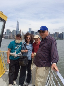 Returning to the Joint Adventure on the ferry, with the Manhattan skyline and the Freedom Tower in the background. From left to right:  Jim K, Kate, Hank, and Tom.